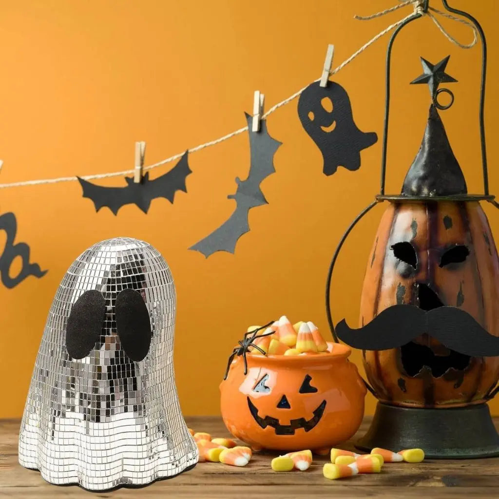 Close-up of mosaic glass tiles on Halloween ghost creating disco ball reflections and sparkle