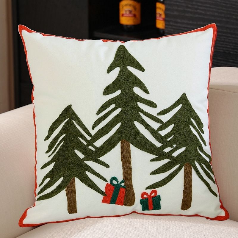 Festive pillow case with detailed snowflake embroidery and mountain motif in blue and white
