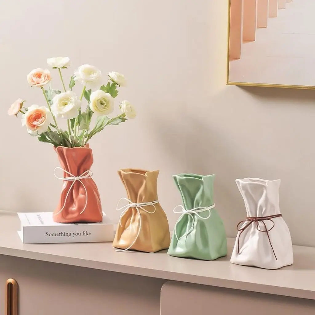 Modern decorative pottery featuring ceramic construction with distinctive rope accent design