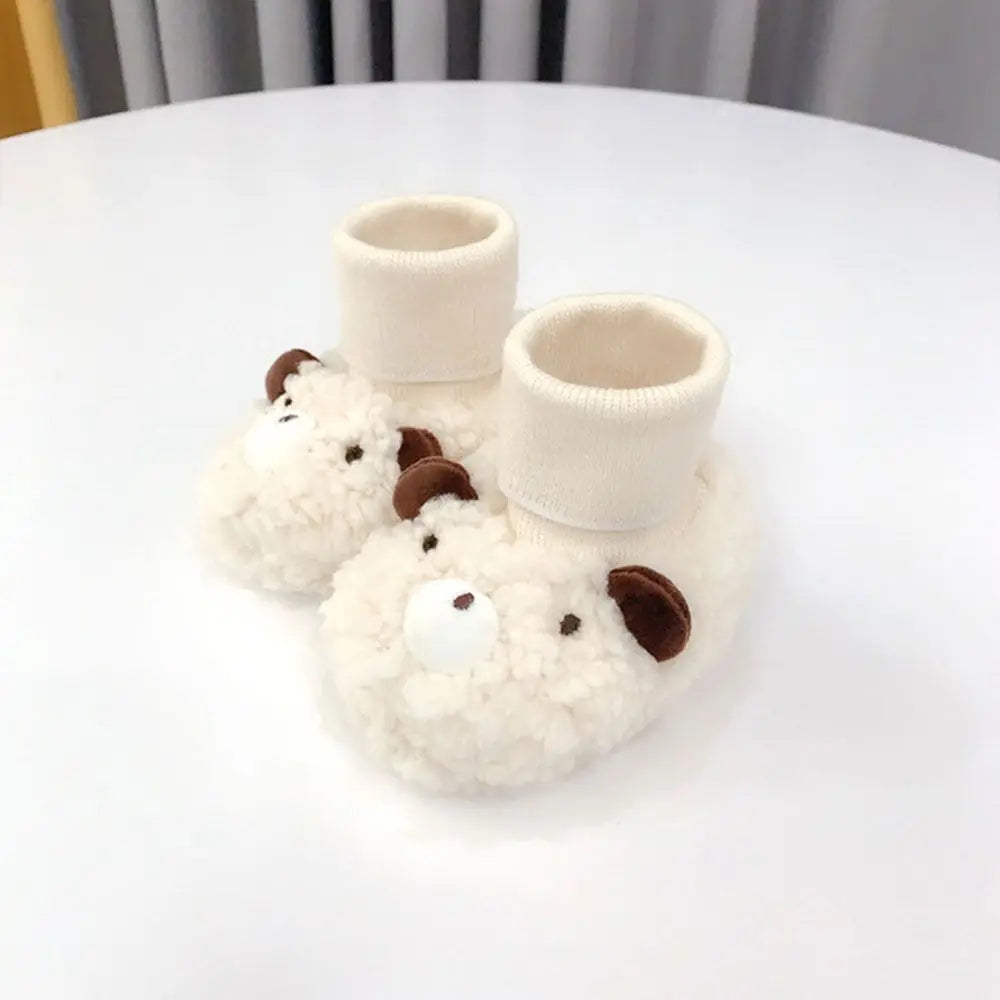 Title: Baby Bear Slippers - Soft Cotton Non-Slip for Boys & Girls

Handle: baby-bear-slippers-soft-cotton-non-slip

Product Description: 
Dress your little one in style with our Baby Bear Slippers! Made from soft cotton, these cozy slippers are perfect for both boys and girls. Plus, the non-slip design ensures your little explorer can roam safely around the house. Perfect for keeping those tiny toes warm and cute!

Variants: 
- Size: 0-6 months
- Size: 6-12 months
- Size: 12-18 months
- Size: 18-24 months