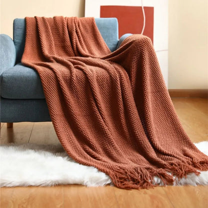 Pineapple pattern blanket in knitted acrylic with geometric design and cozy texture