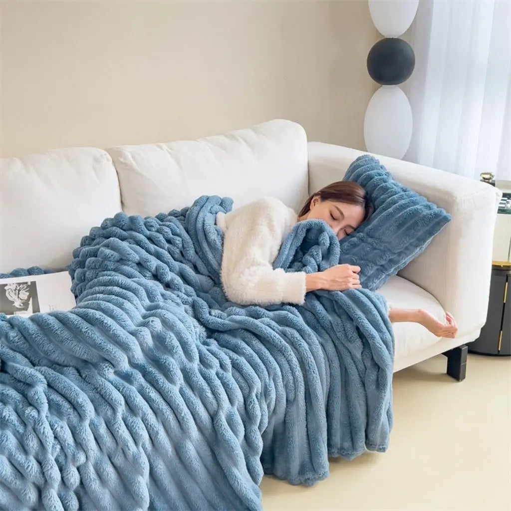 Soft polyester flannel throw with plush ribbed surface texture for bedroom use