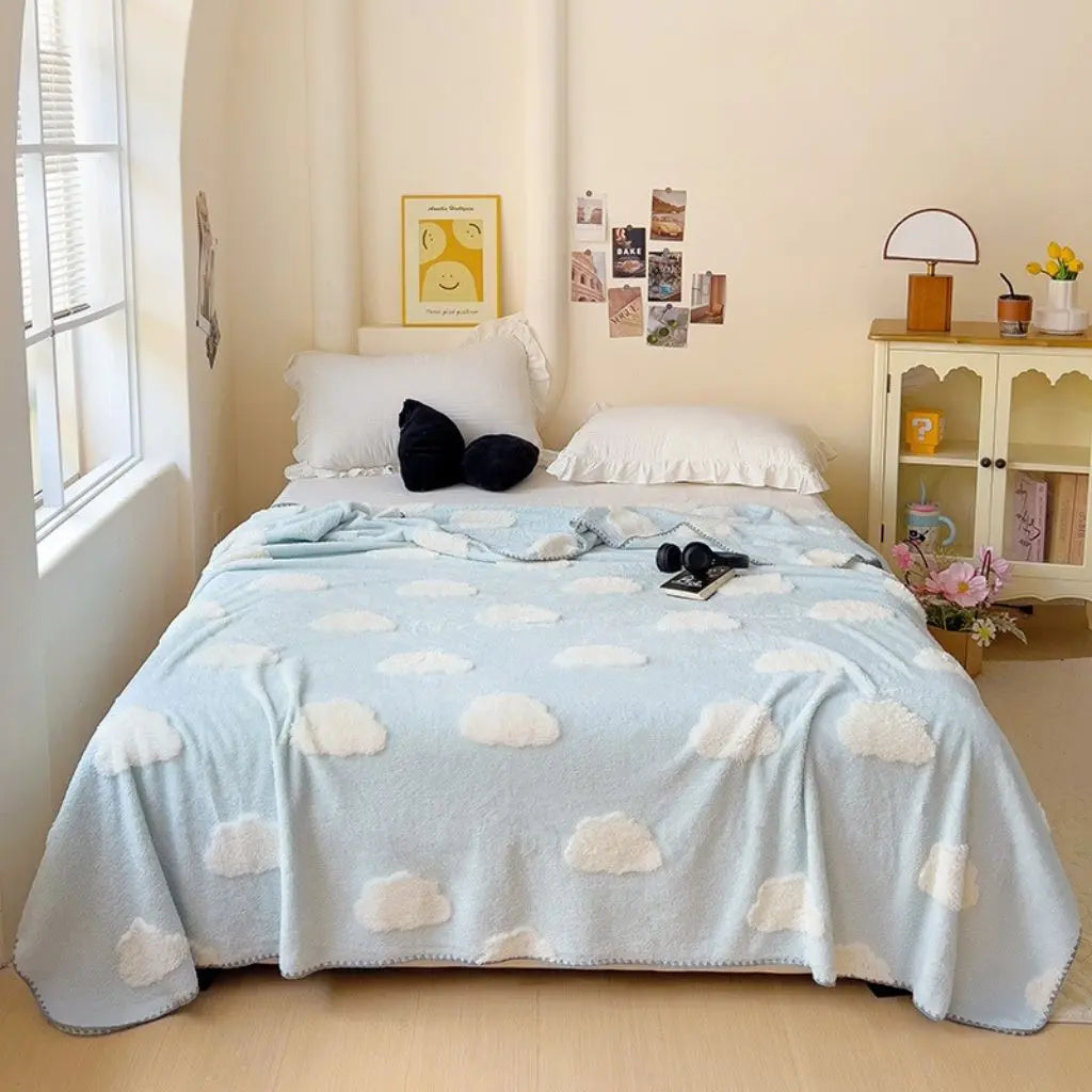 Neatly folded bamboo coral fleece blanket showing lightweight compact design