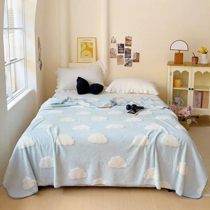 Neatly folded bamboo coral fleece blanket showing lightweight compact design