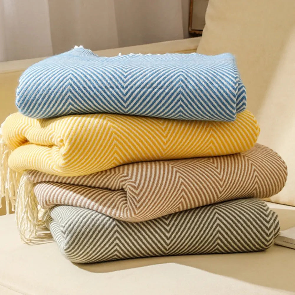 Durable acrylic herringbone throw blanket with subtle stripe pattern and fringe finish
