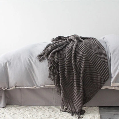 Woven fringe throw blanket with detailed texture pattern for living room comfort