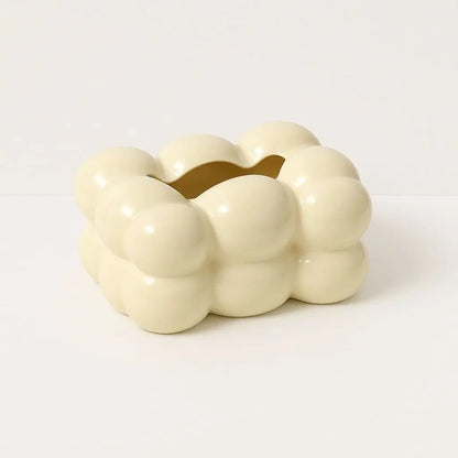 Close-up of sculptural ceramic tissue box showing detailed bubble texture and smooth finish