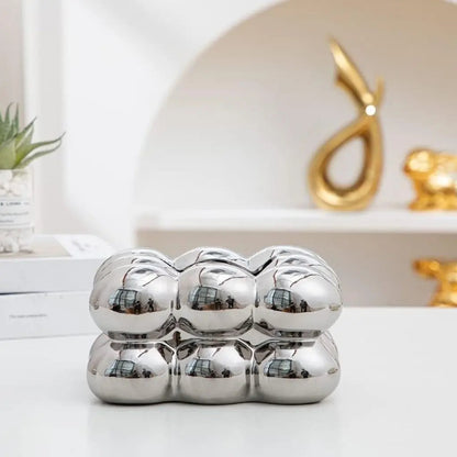Polished ceramic tissue holder with decorative bubble accent, available in multiple color options