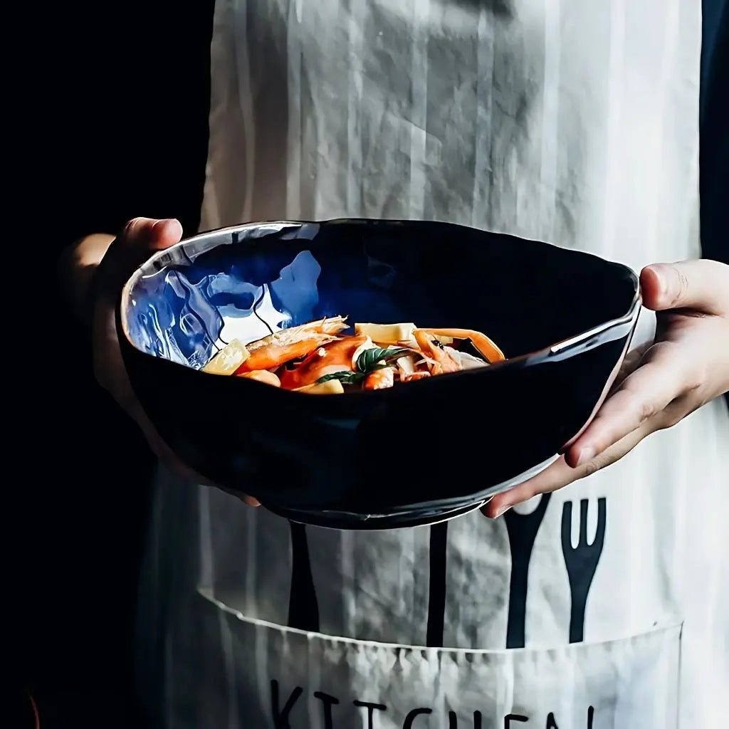 Artisan ceramic serving bowl featuring unique irregular design, ideal for contemporary kitchen and dining