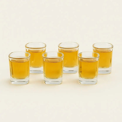 Luxury crystal shot glass collection with elegant wooden display rack for premium spirits

