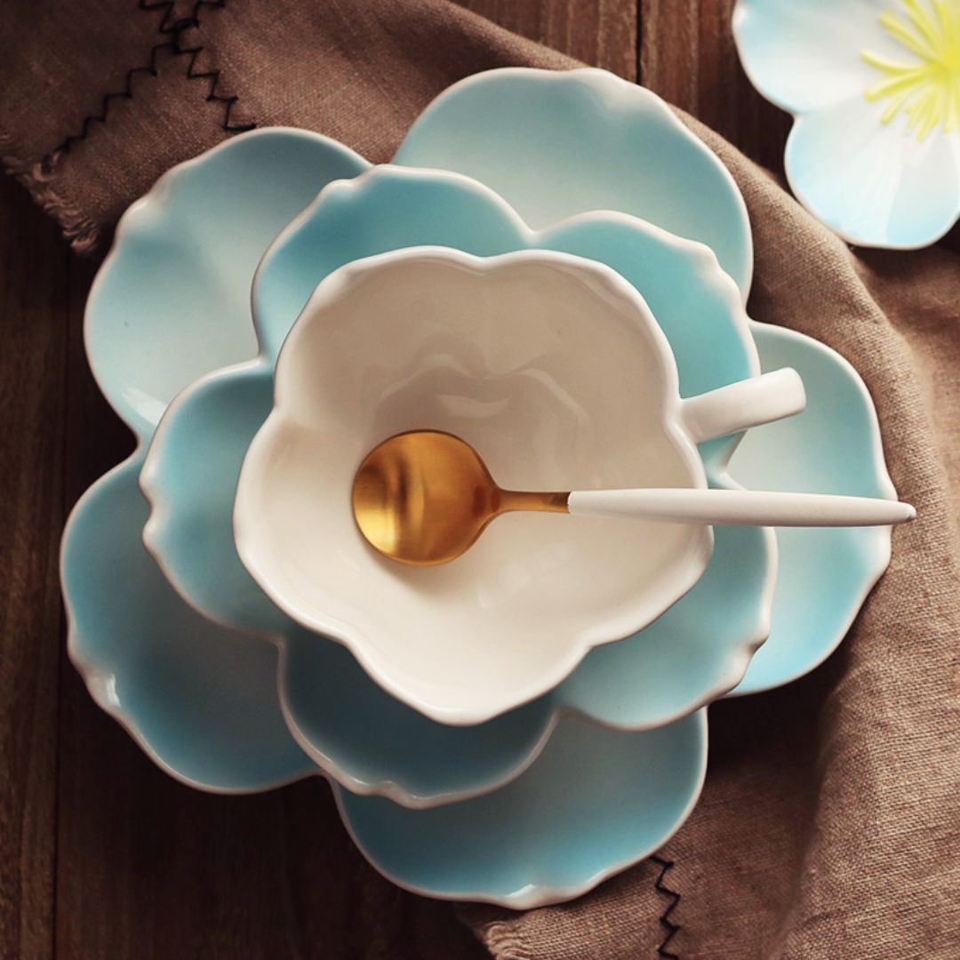 White porcelain tea cup and saucer set with modern petal shaped design for tea lovers