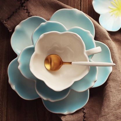 White porcelain tea cup and saucer set with modern petal shaped design for tea lovers