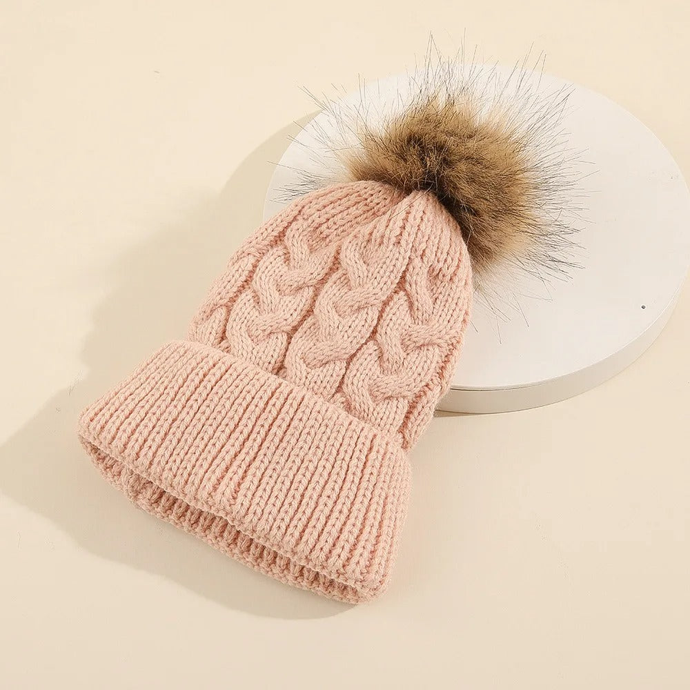 Title: Women's Knit Beanie with Pom Pom - Cozy Acrylic Casual Winter Fashion

Handle: womens-knit-beanie-with-pom-pom-cozy-winter-fashion

Description: Stay stylish and warm this winter with our Women's Knit Beanie featuring a cute pom pom on top. Made from soft acrylic, this casual winter accessory is perfect for any outing. Grab yours now and rock that cozy look!

Variants: 
- Color: Gray 
- Color: Pink
- Color: Black 
- Color: White 

Get ready to turn heads while keeping snug in the chilly weather!