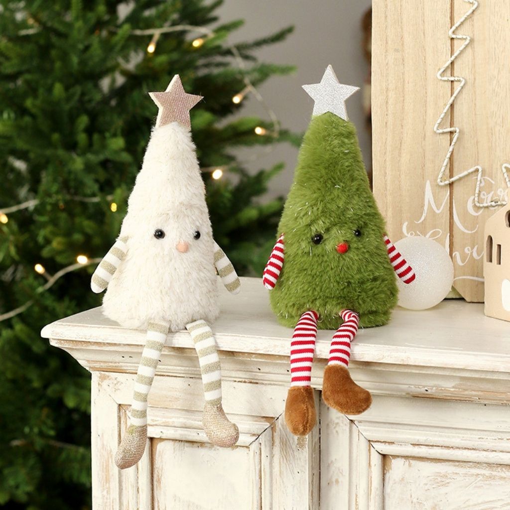Green fabric tree decoration with golden star and festive striped pattern