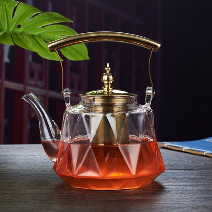 Clear borosilicate glass tea kettle with built in metal filter for steeping loose leaf tea