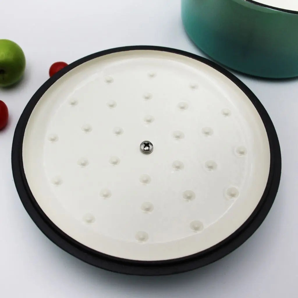 Non stick ceramic coated interior of cast iron soup pot showing smooth surface for easy cleanup and cooking