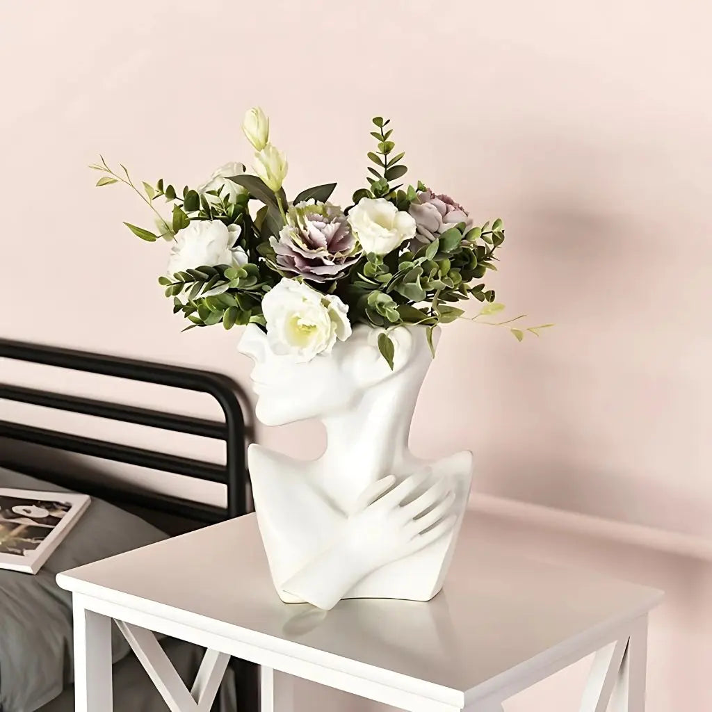 Handcrafted ceramic vase featuring minimalist human head silhouette, artistic flower holder for modern table decor