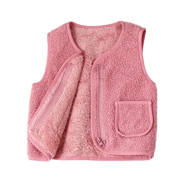 Title: Kids' Lambswool Look Vest - Cozy Polyester

Handle: kids-lambswool-look-vest-cozy-polyester

Description: Check out our Kids' Lambswool Look Vest! Made from warm polyester, this stylish gilet is perfect for keeping your little ones snug and comfy. It's great for chilly days and adds a touch of cool to any outfit. 

Variants: 
- Size: Small
- Size: Medium
- Size: Large

Snag this cozy vest for your kiddos today!