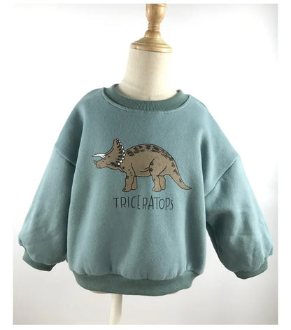 Title: Kids' Fun Dinosaur Print Sweater

Handle: kids-fun-dinosaur-print-sweater

Description: Check out our Kids' Fun Dinosaur Print Sweater! Made from 100% cotton and featuring a super cool green dino design, this comfy sweater is perfect for your little adventurers aged 6. Whether they're off to school or just chilling at home, they'll love wearing their new dino pals!

Variants: 
- Size: 6
- Color: Green

Get ready for some dino-mite style!