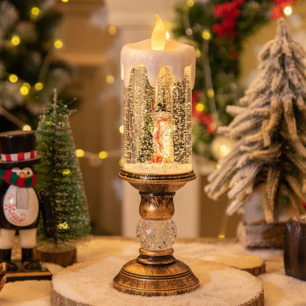 Holiday decoration lantern showing swirling snow particles and warm LED glow