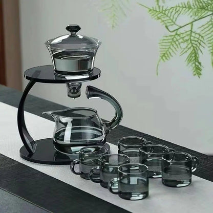 Stylish glass tea brewing system featuring automatic infuser, sturdy stand, and 6 serving cups 