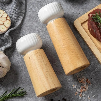 Ceramic pepper mill with wood body designed for manual operation and adjustable spice grinding

