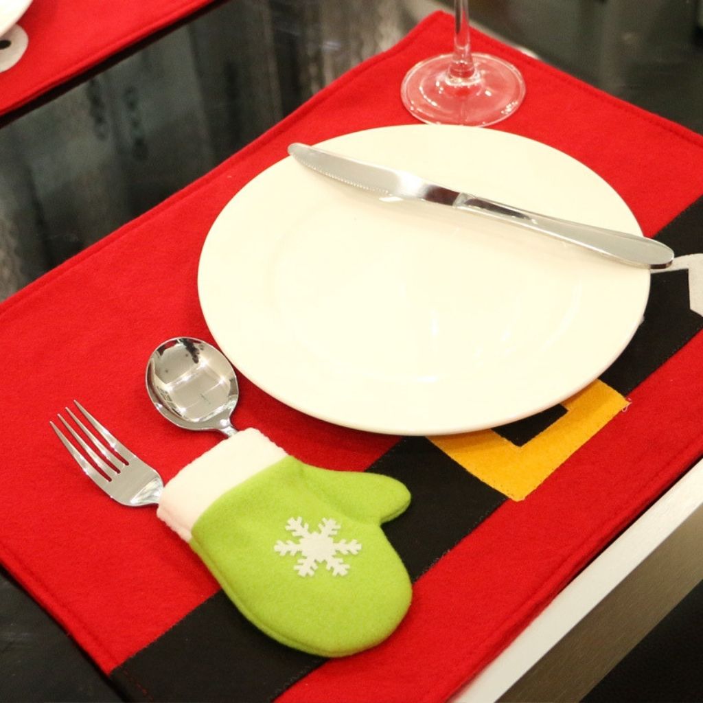 Holly patterned table mat with red berries and green leaves for holiday dining