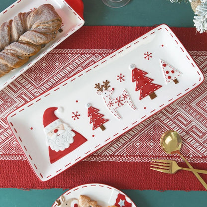 White ceramic serving dish with festive holiday design and easy grip handles