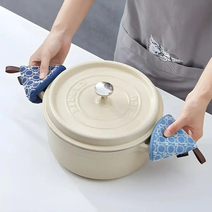 Quilted Nordic cooking mitts with cone design, providing heat resistant protection for kitchen tasks