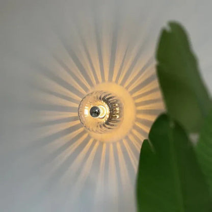 Stunning Glass Wall Lamp With Sunburst Design And Warm Glow