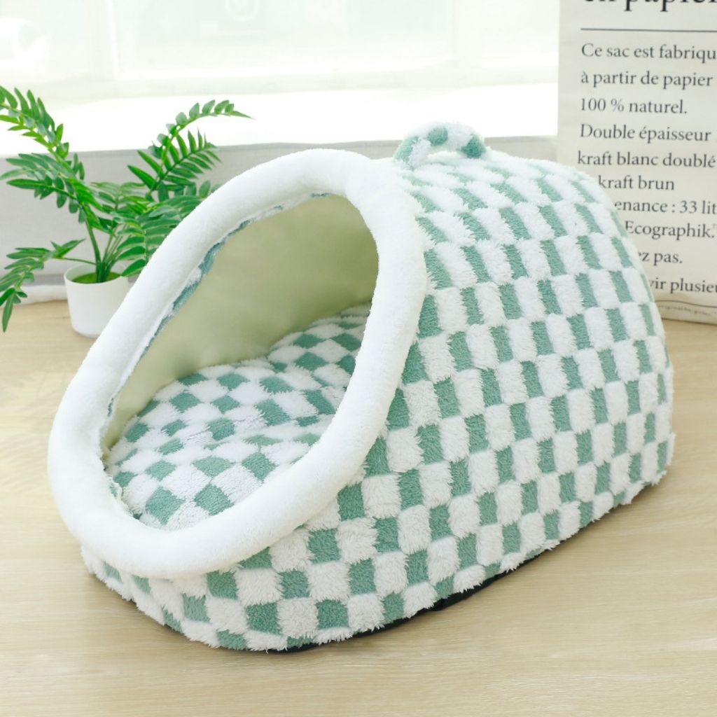 Overhead angle of black white pet bed showing cushioned interior and semi covered design