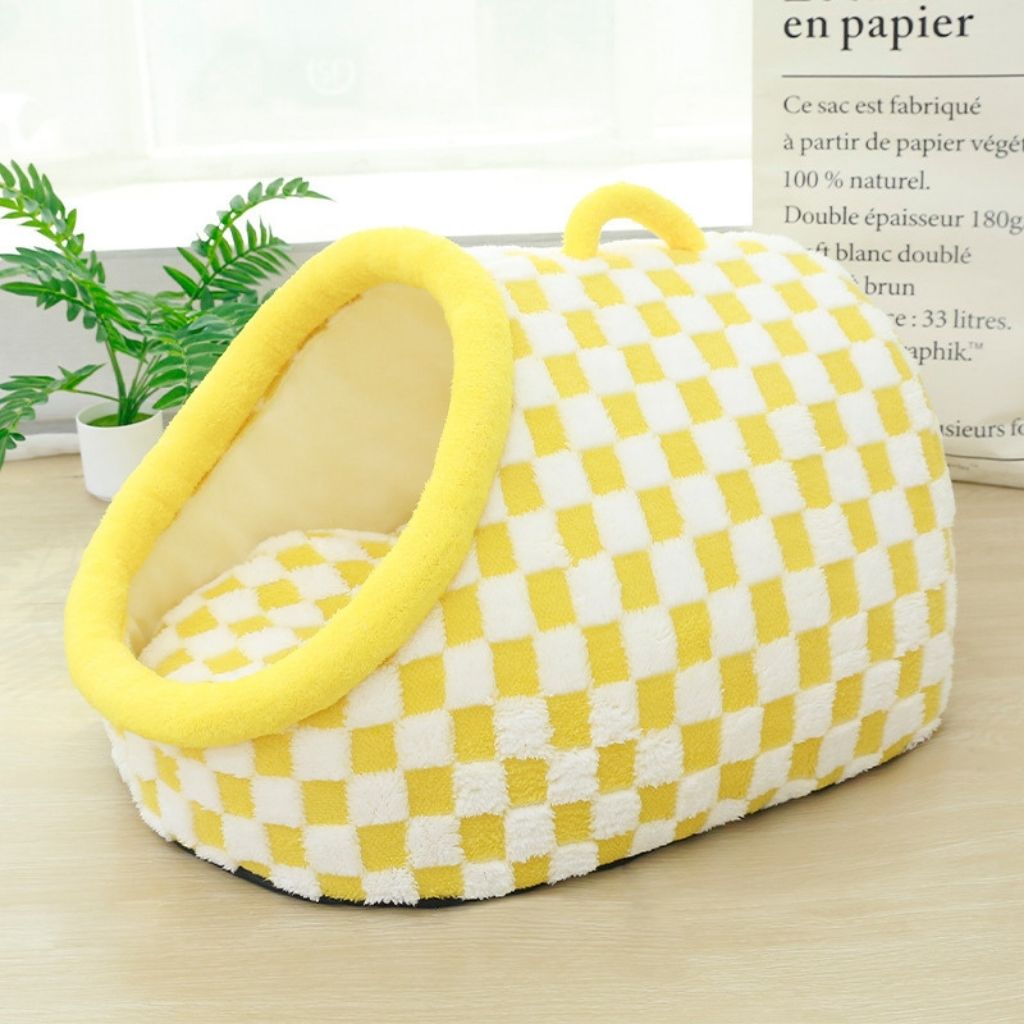 Full product view of black white checkered pet bed with raised sides and plush cushion base