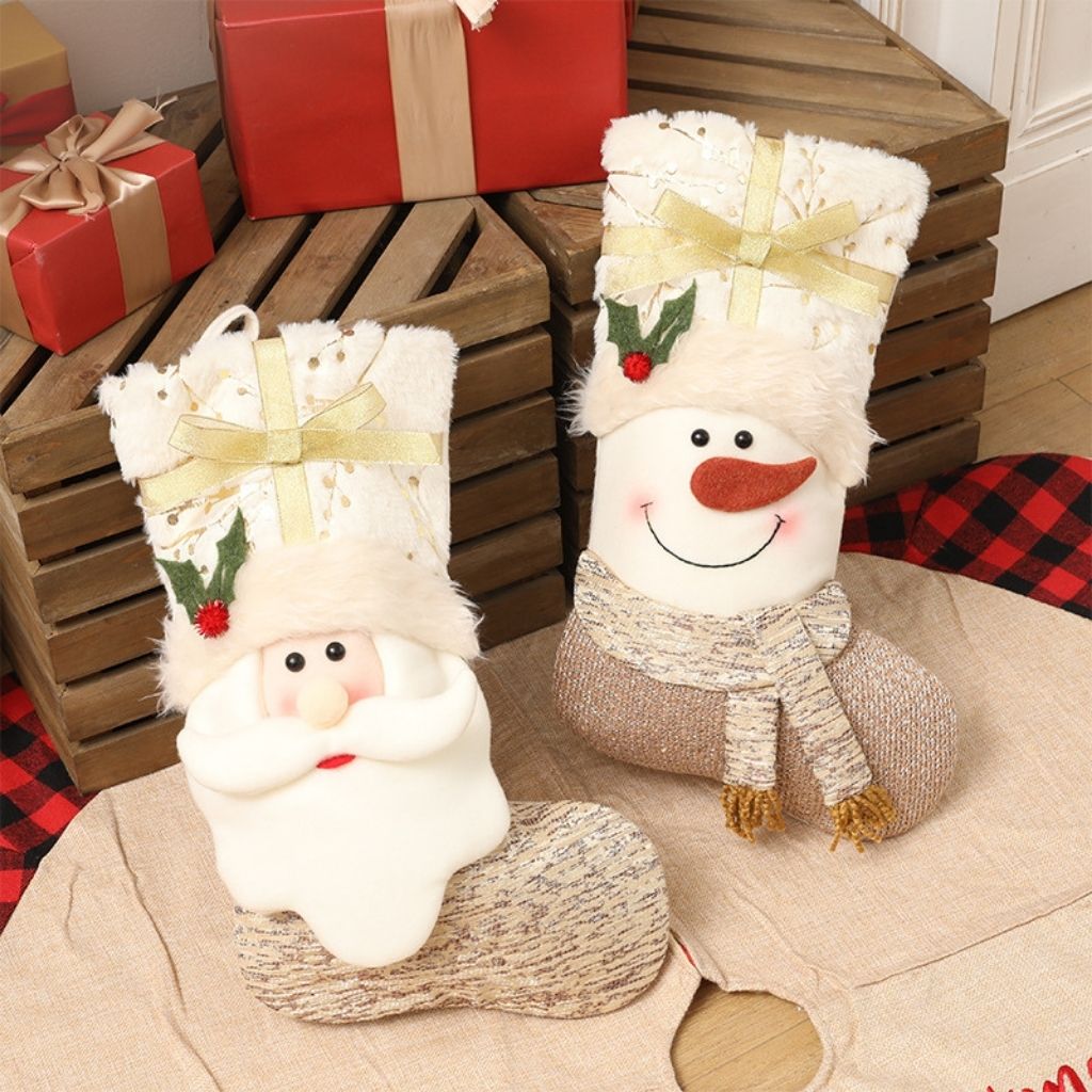 Plush fabric Christmas stocking with character applique on white background