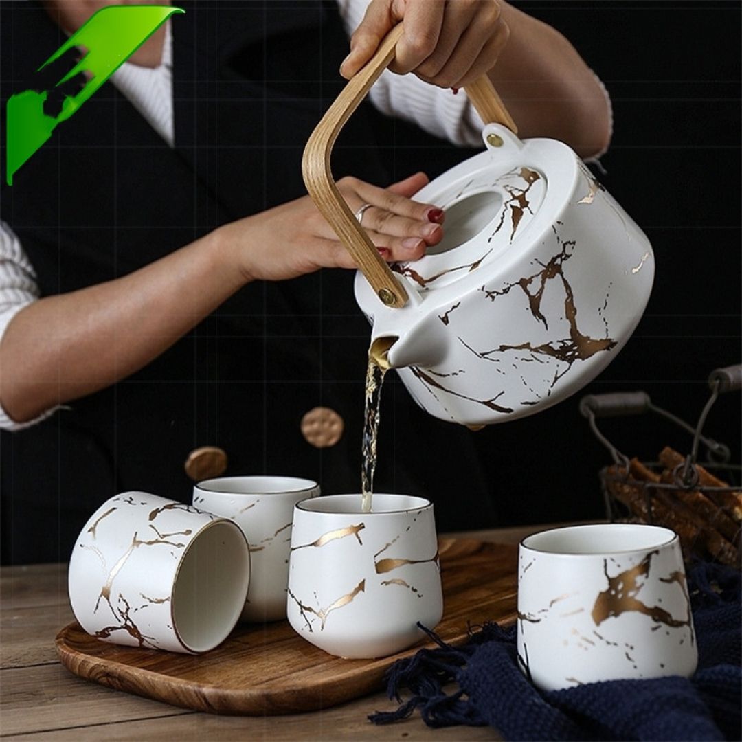 Complete ceramic tea service with marble glaze teapot cups and matching tray