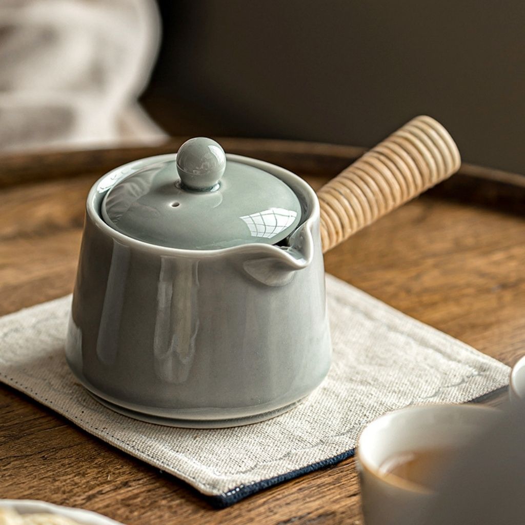 Side handle ceramic teapot with smooth pouring spout and minimalist gray glaze finish