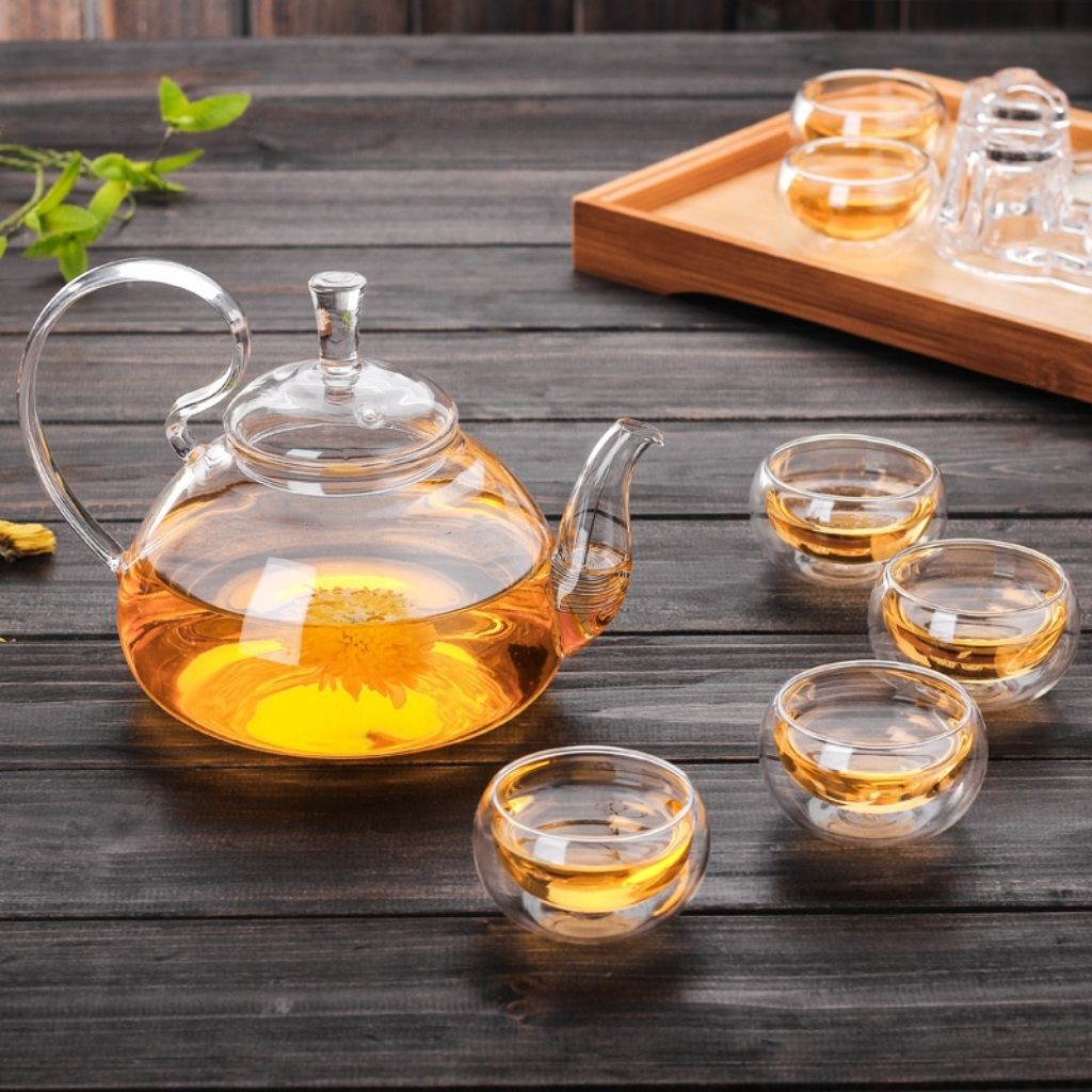 Heat proof glass tea server with curved spout for clean drip free pouring