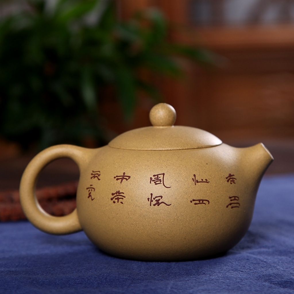  Bottom view of purple sand clay teapot base with artisan stamp and smooth finish