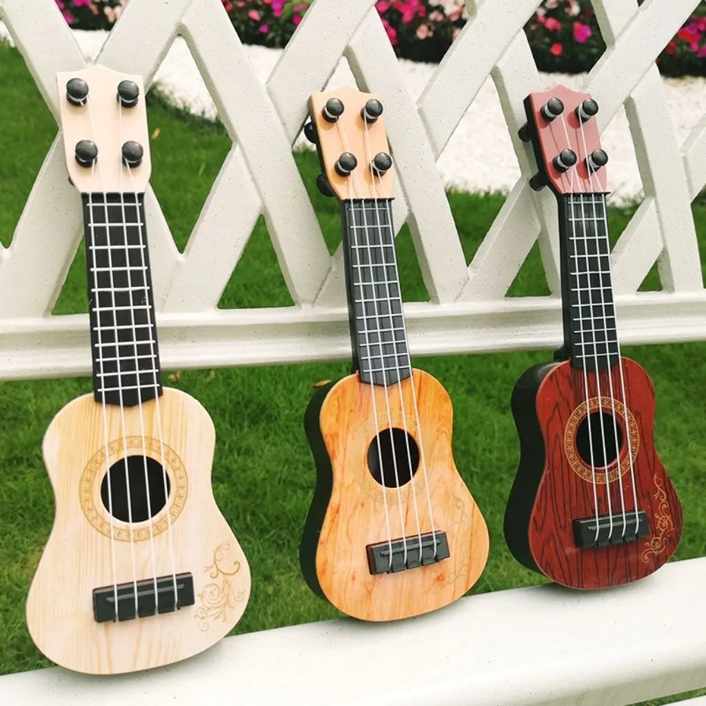Kids guitar toy close-up - lightweight mini guitar with wood grain finish for small hands