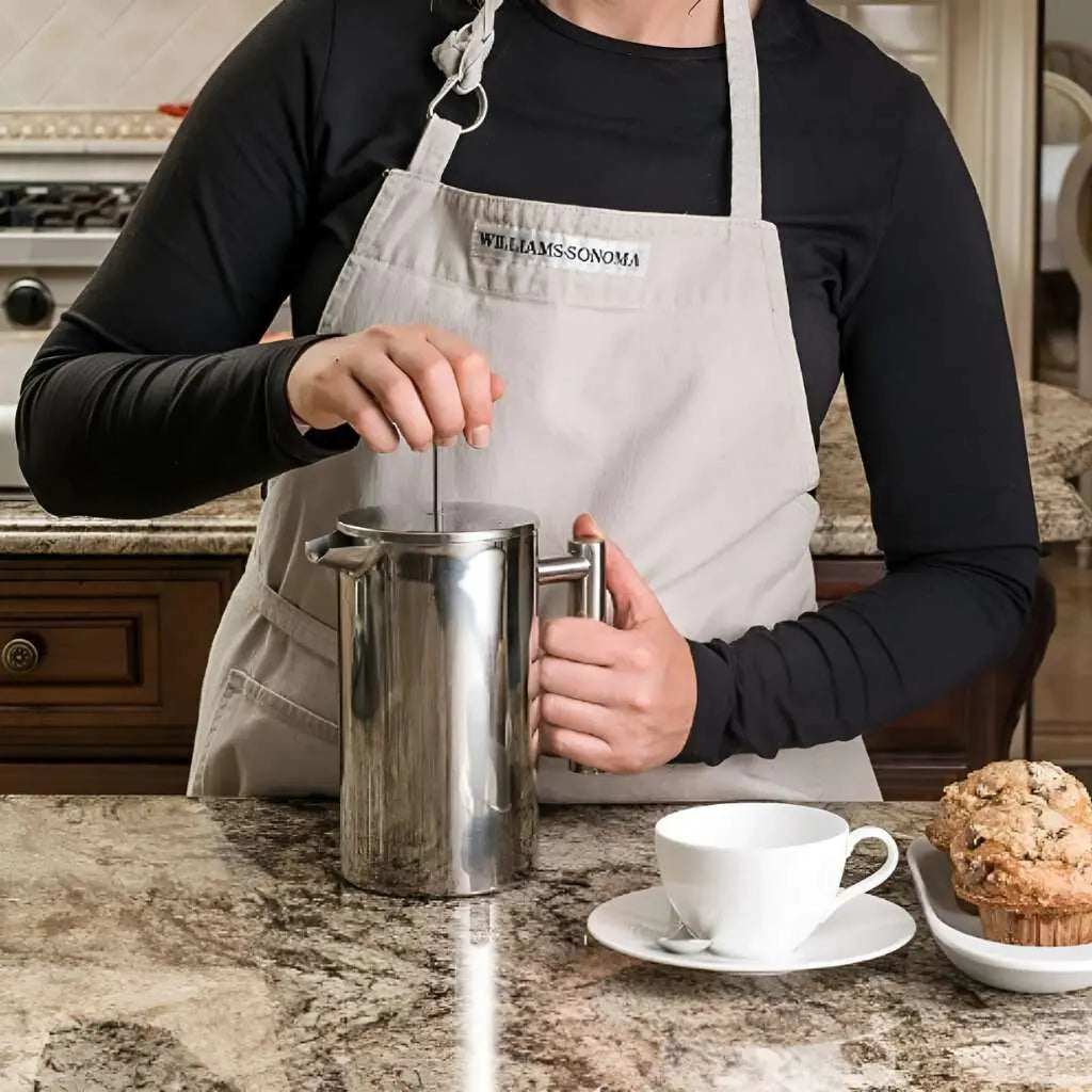 Stainless steel french press with double wall insulation and precision filter for coffee brewing
