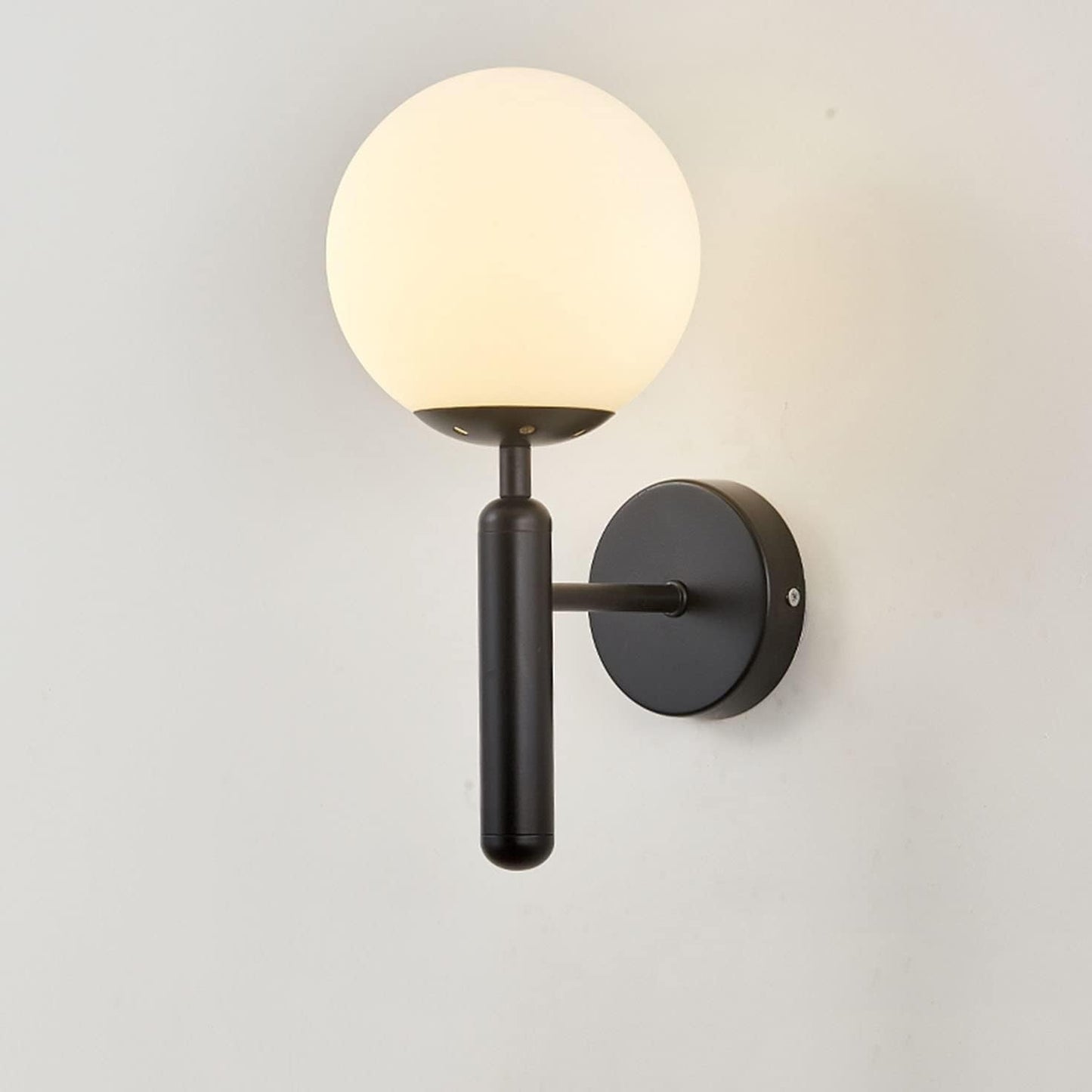 Bright Glass Globe LED Wall Light in Brass Finish