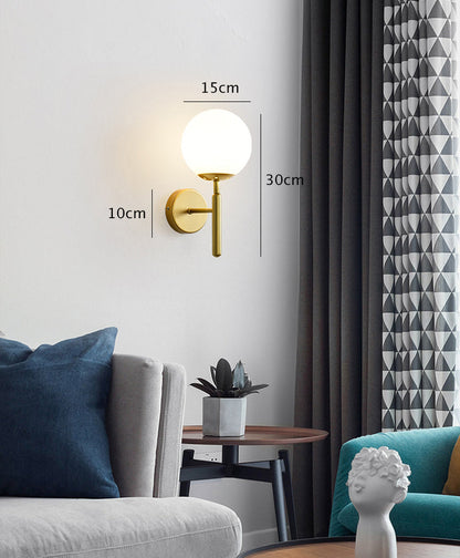 Bright Glass Globe LED Wall Light in Brass Finish