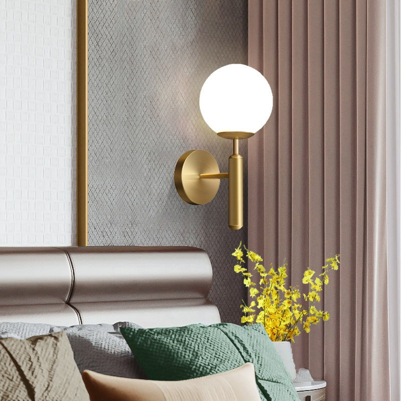 Bright Glass Globe LED Wall Light in Brass Finish