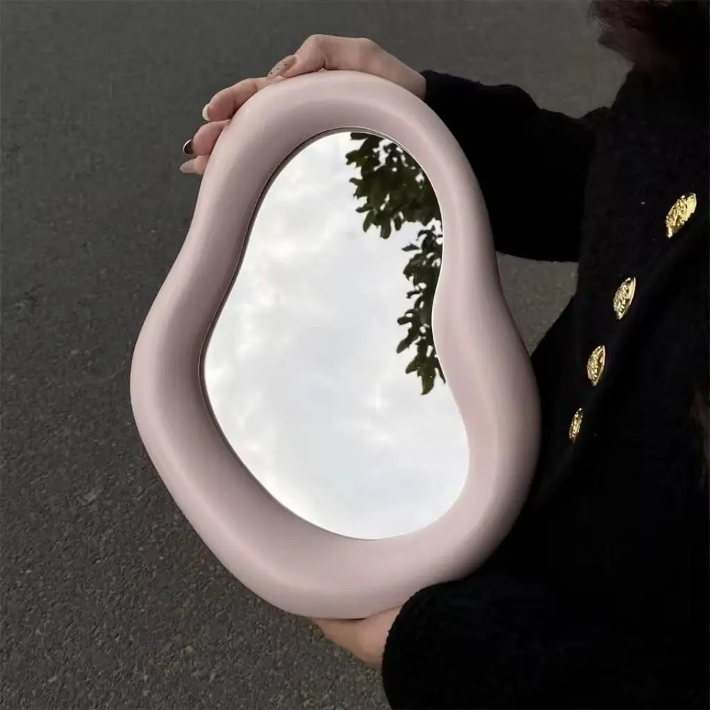 Versatile cloud mirror with organic irregular shape combining vanity function and sculptural home accent