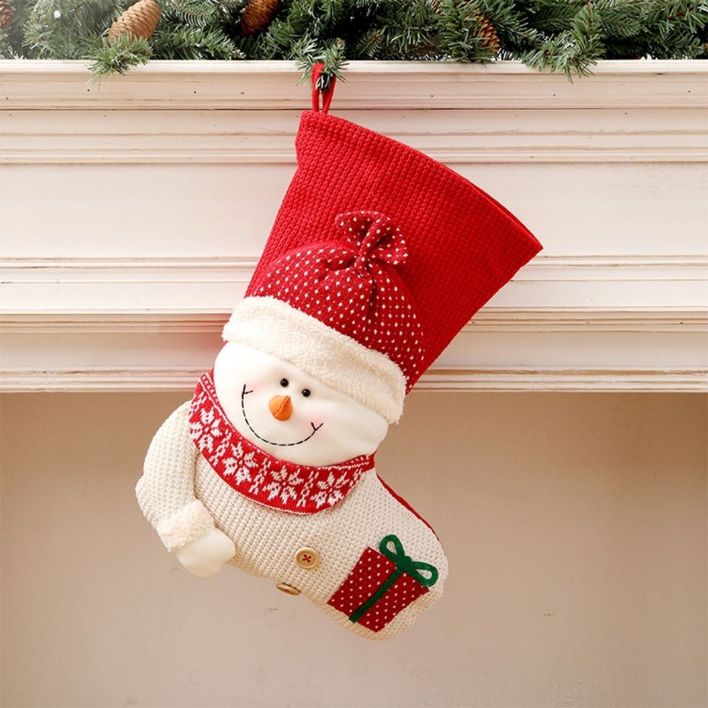 Knit holiday stocking displaying detailed stitchwork and folded cuff